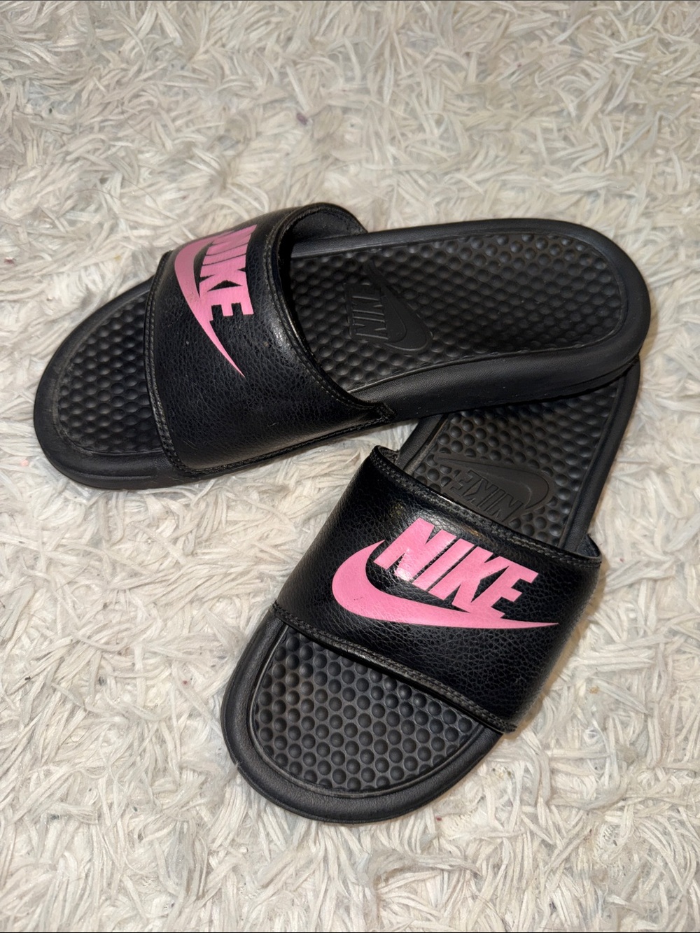 Nike Black womens Slide Sandals with Pink Logo Accent